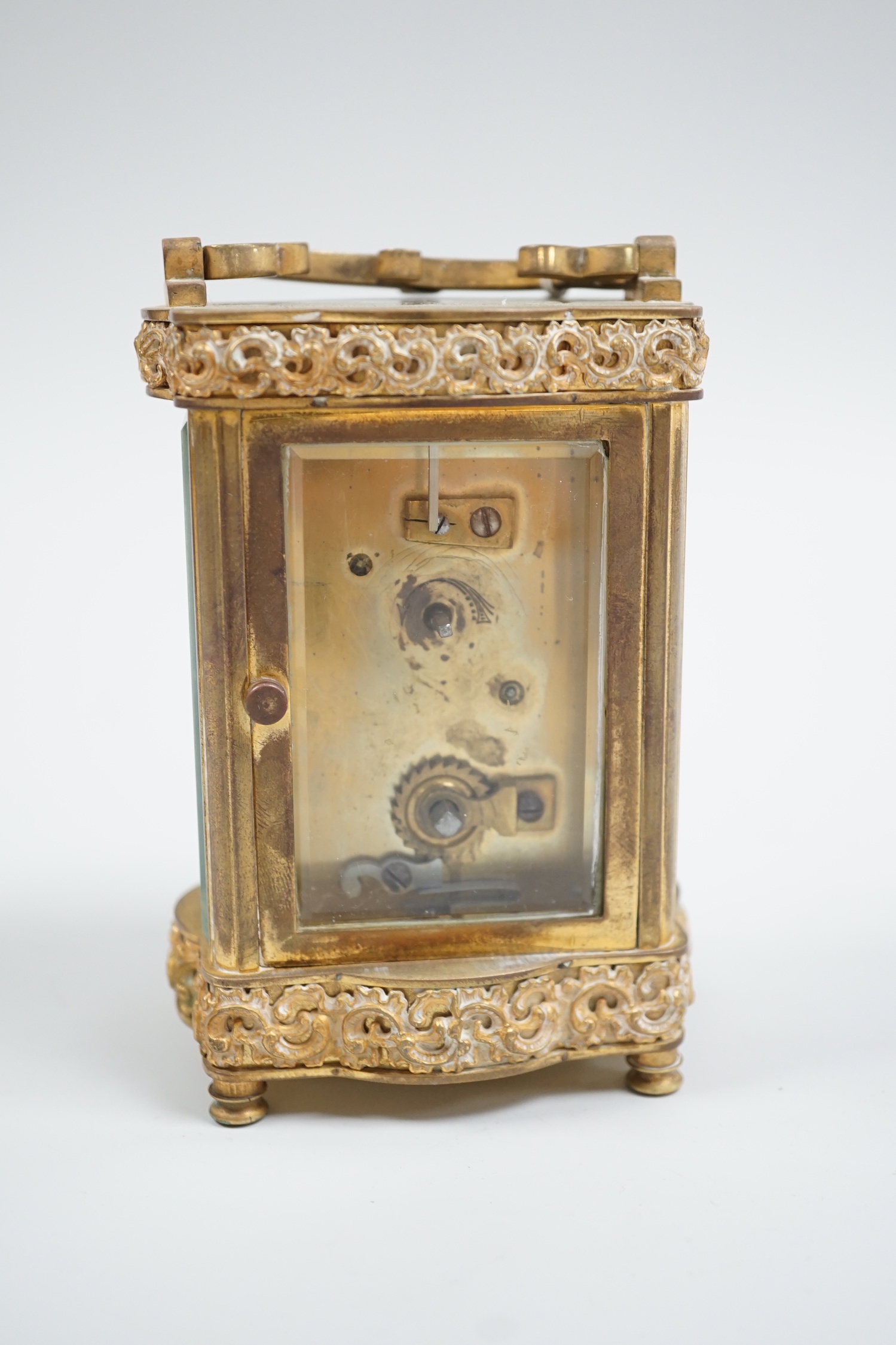 A French gilt brass serpentine carriage timepiece, 12cm high